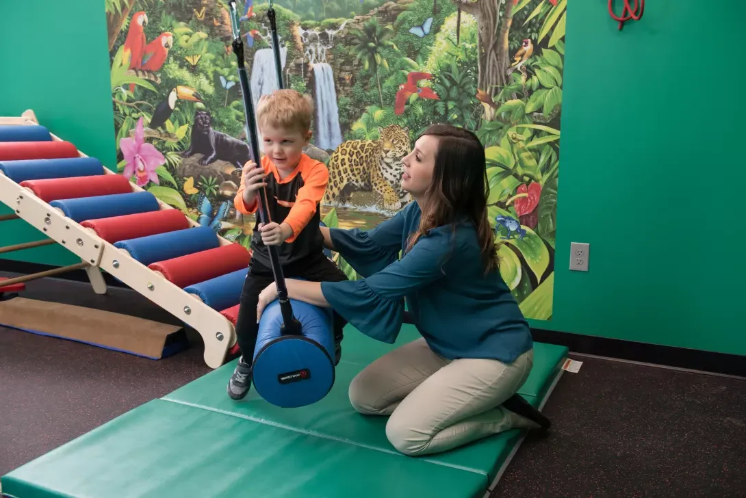 College of Education student working with elementary student in sensory room